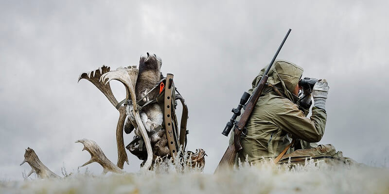 hunter using a binocular
