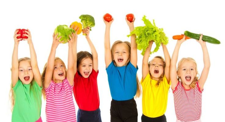 kids holding veggies