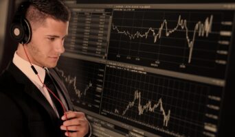Businessman monitoring stocks
